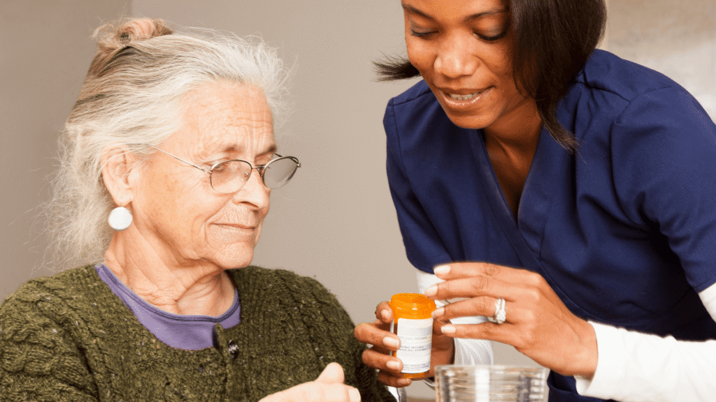 Caregiver helping senior manage medication with empathy and support.